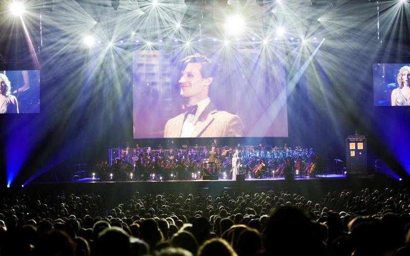 Eleventh Doctor Matt Smith on the big screen while Ben Foster conducts the BBC National Orchestra of Wales and the BBC National Chorus of Wales, with soprano Elin Manahan Thomas. Image: House PR