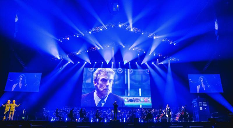 The Doctor Peter Capaldi on the screen while Ben Foster conducts the BBC National Orchestra of Wales and the BBC National Chorus of Wales with soprano Elin Manahan Thomas and The Ood. Image: House PR